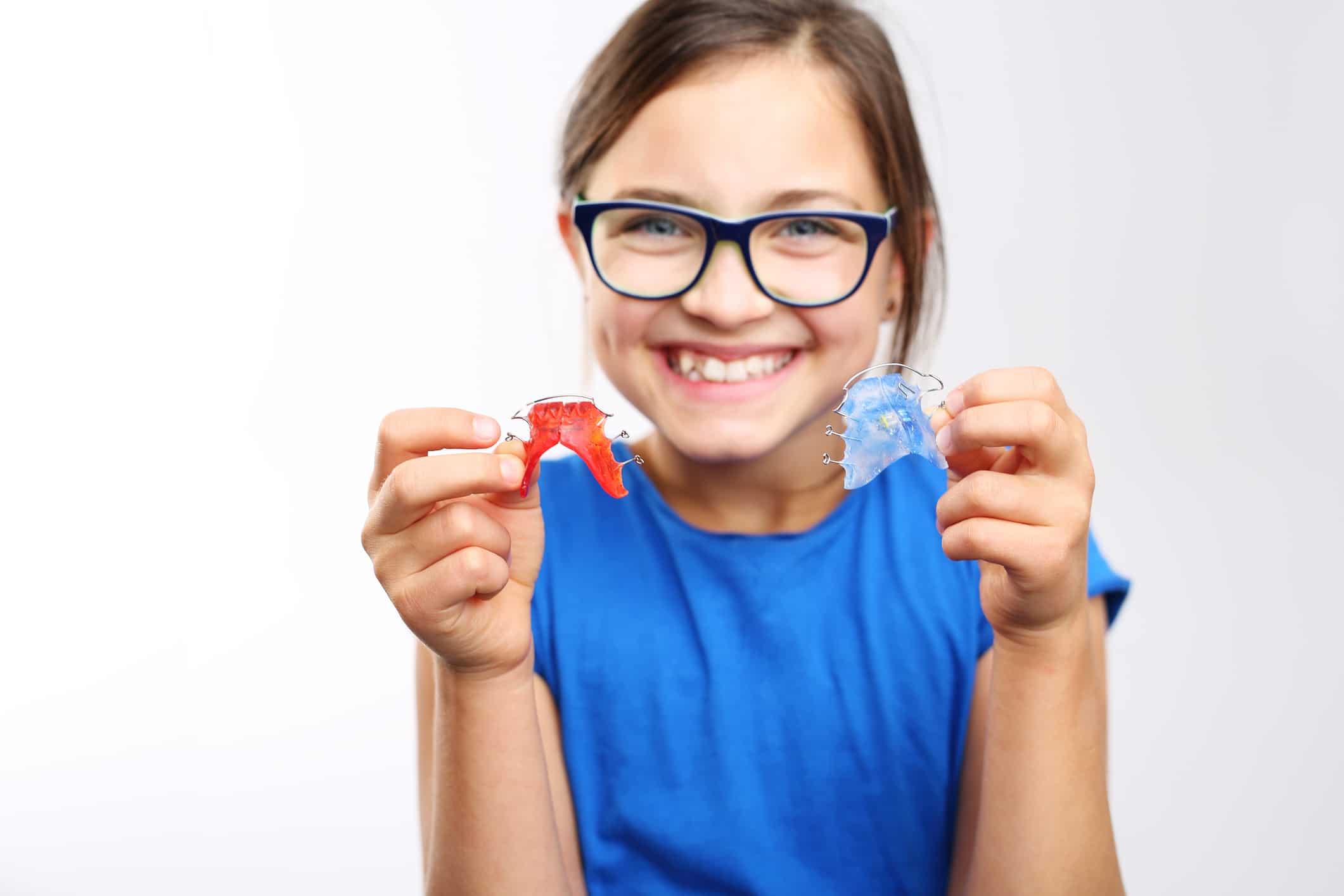 Child holding a retainer, Smile Envy Dental Group, Atlanta, GA